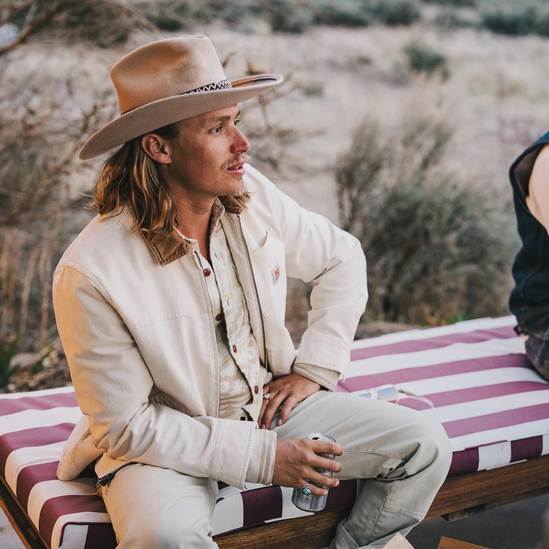Lifestyle shot of the Howler Bros Conveyer Coat in Au Naturel - Endless Waves