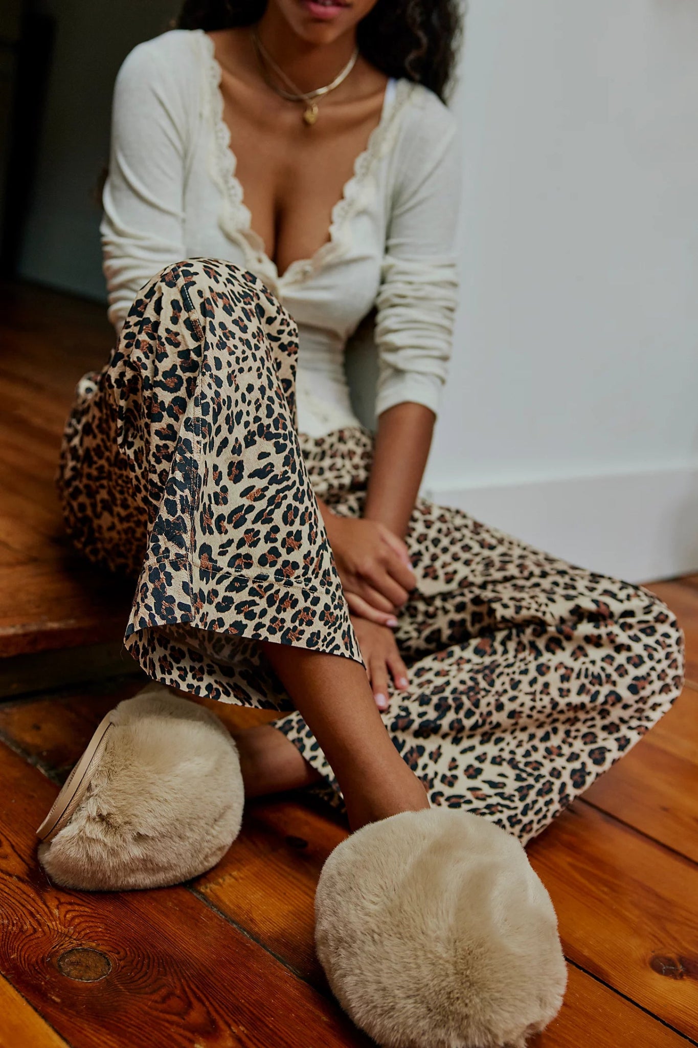 Free People Snowball Slippers on model with leopard pants