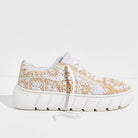 Profile view of the Catch Me If You Can Crochet Sneaker in Cream with floral woven details and chunky lug sole