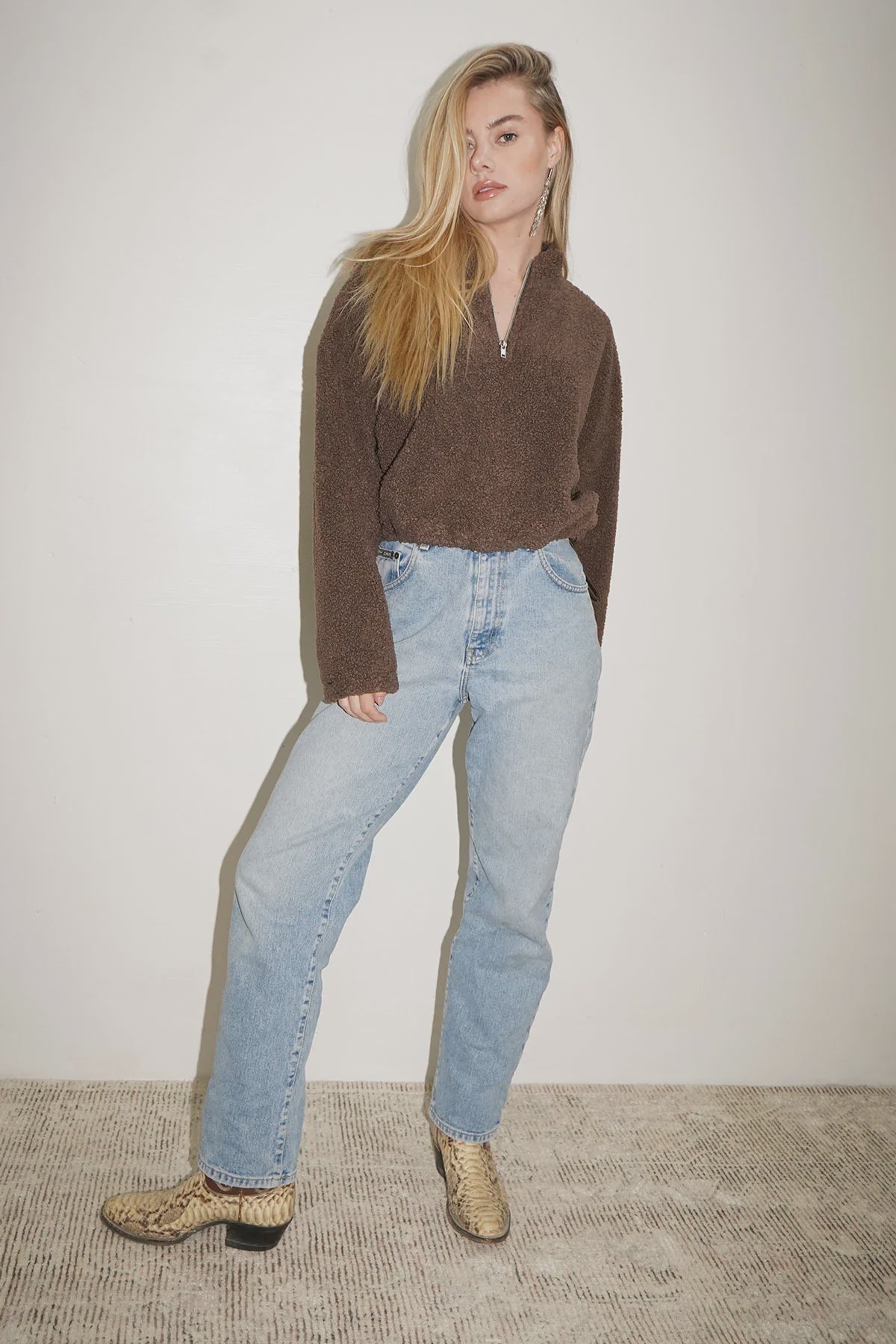 LNA Sherpa Half Zip in Brown Sherpa styled with high-rise, light wash jeans and exotic boots.