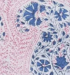 A close-up of a paisley patterned fabric swatch featuring intricate floral and teardrop motifs in blue and pink on a white background.