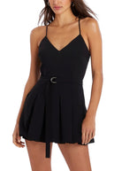 Close up of a woman wearing the Amanda Uprichard Blair Belted Romper in Black - On Sale at Endless Waves Boutique
