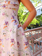 Side view of the Aqua Blu Adele Maxi Dress in Moonflower print, highlighting the hidden side seam pockets and the structured linen-silk blend fabric.