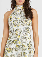 Model wearing Aqua Blu Australia Clementine Kaley Mini Dress floral mock halter mini dress.