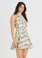 Model wearing Aqua Blu Australia Clementine Kaley Mini Dress floral mock halter mini dress.