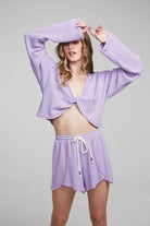 Woman wearing the Chaser Briaa Thermal Long Sleeve and matching Jimi Thermal Shorts in Digital Lavender.