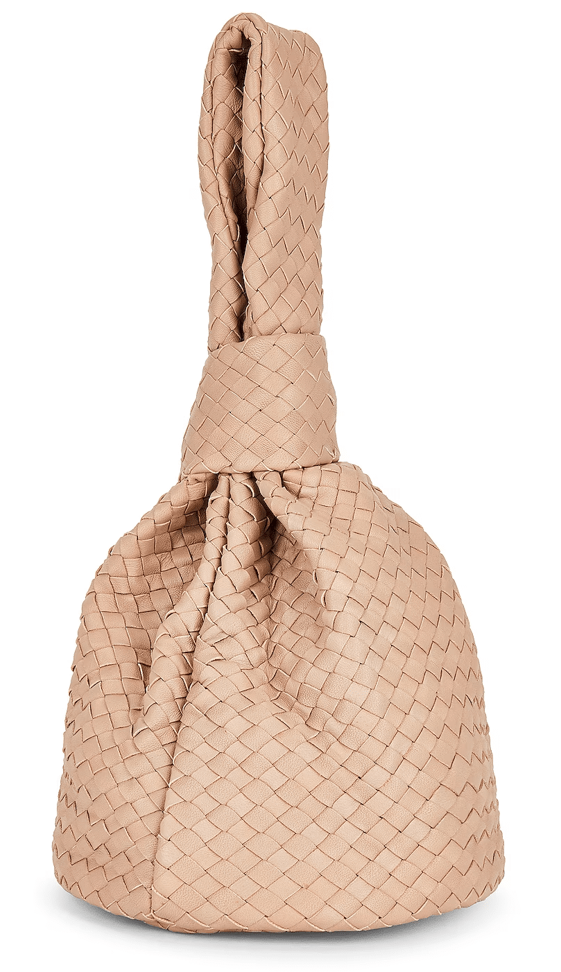 View of the Bone Cleobella Celine Woven Handbag showing the hand-braided leather and top knot handle.