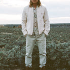 Lifestyle photo showing the Howler Bros Conveyer Coat in Au Naturel -  Endless Waves