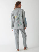 Back view of the Electric & Rose Embroidered Chore Jacket showing the vertical indigo pinstripes and relaxed silhouette.