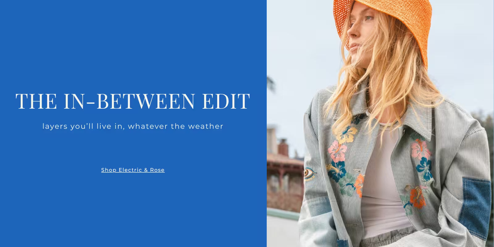 Model wearing the Electric & Rose Embroidered Chore Coat in blue, a floral patchwork utility jacket perfect for seasonal layering.