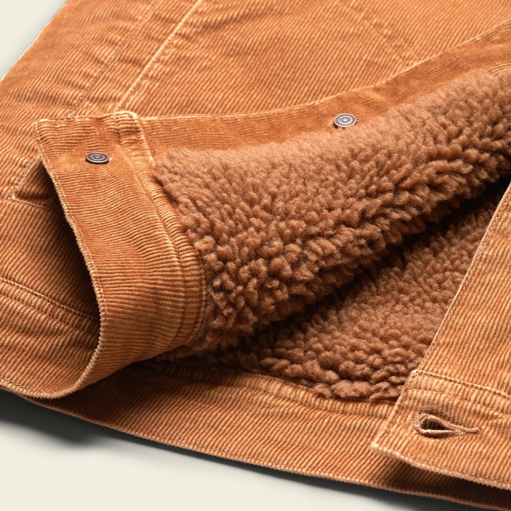 Close up of the sherpa lining on the Howler Brothers Fuzzy Depot Jacket in Duck Brown Cord.