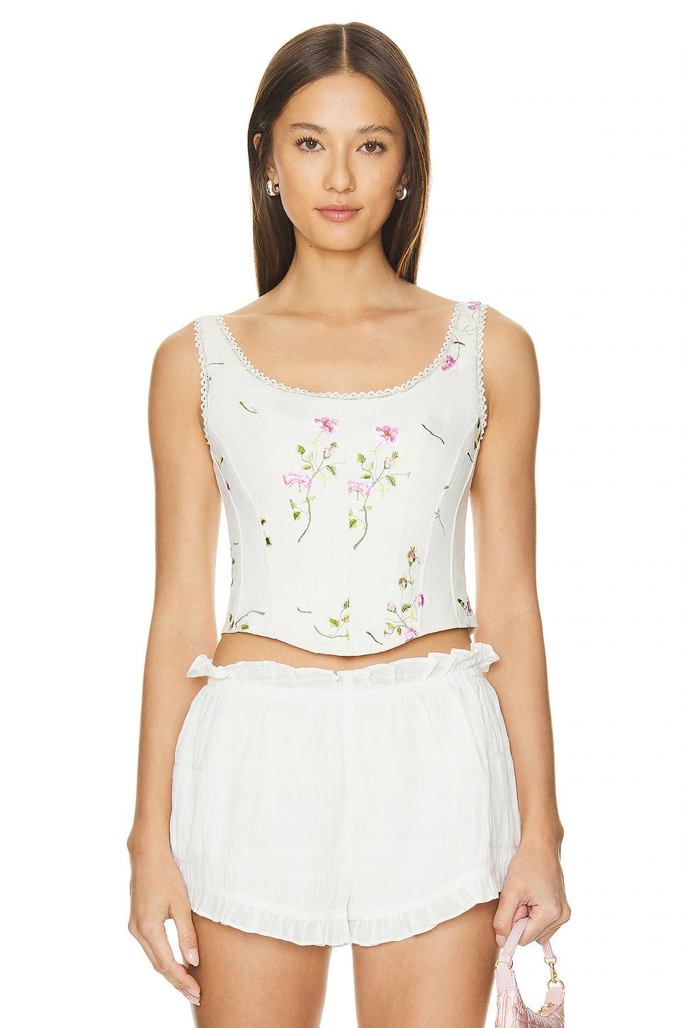 LoveShackFancy Rhapsody Bustier in Antique White featuring a pink floral print, lace trim neckline, and structured corset boning.