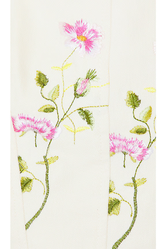 Close-up of the LoveShackFancy Rhapsody Bustier fabric in Antique White featuring a pink winding floral print and cotton-stretch twill texture.