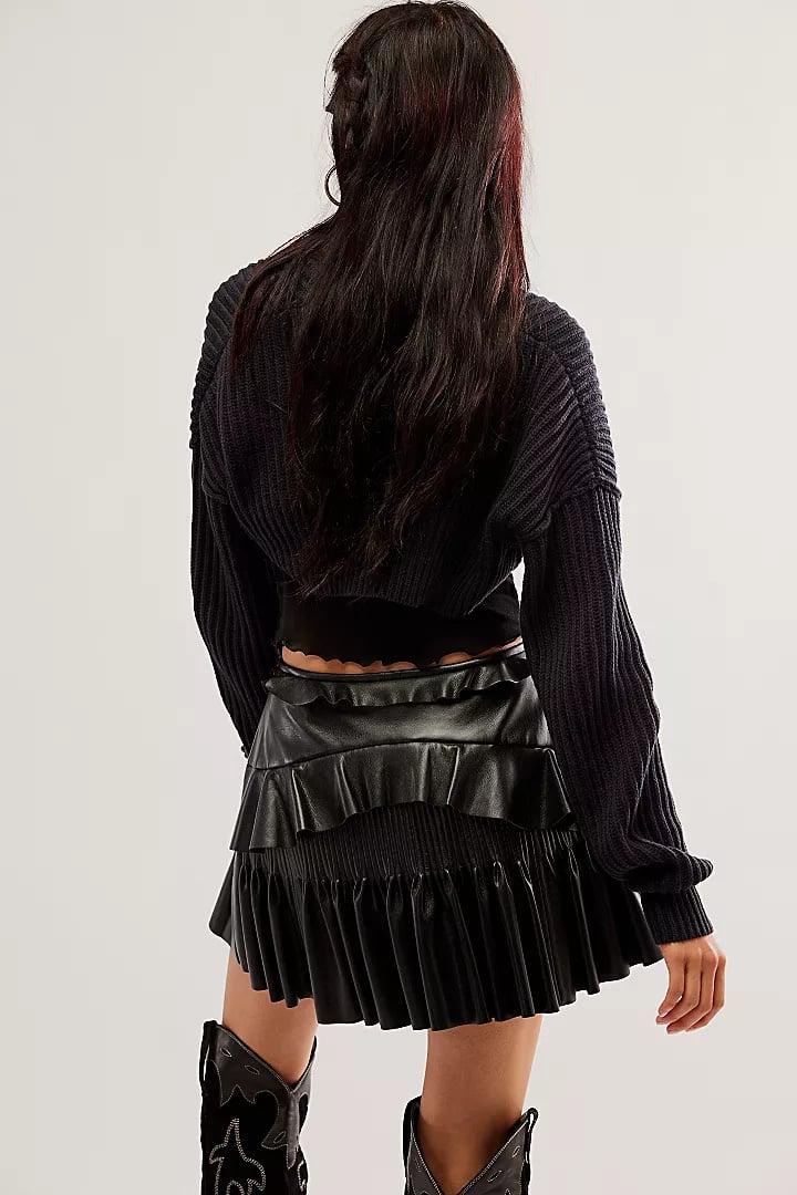 Rear view of a model wearing the LSF Eli vegan leather skirt.