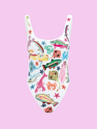 Flat-lay view of the white Oceanus Arizona one-piece swimsuit, showcasing a vibrant all-over sea life embroidery including pink fish, orange crabs, and green coral with crystal accents
