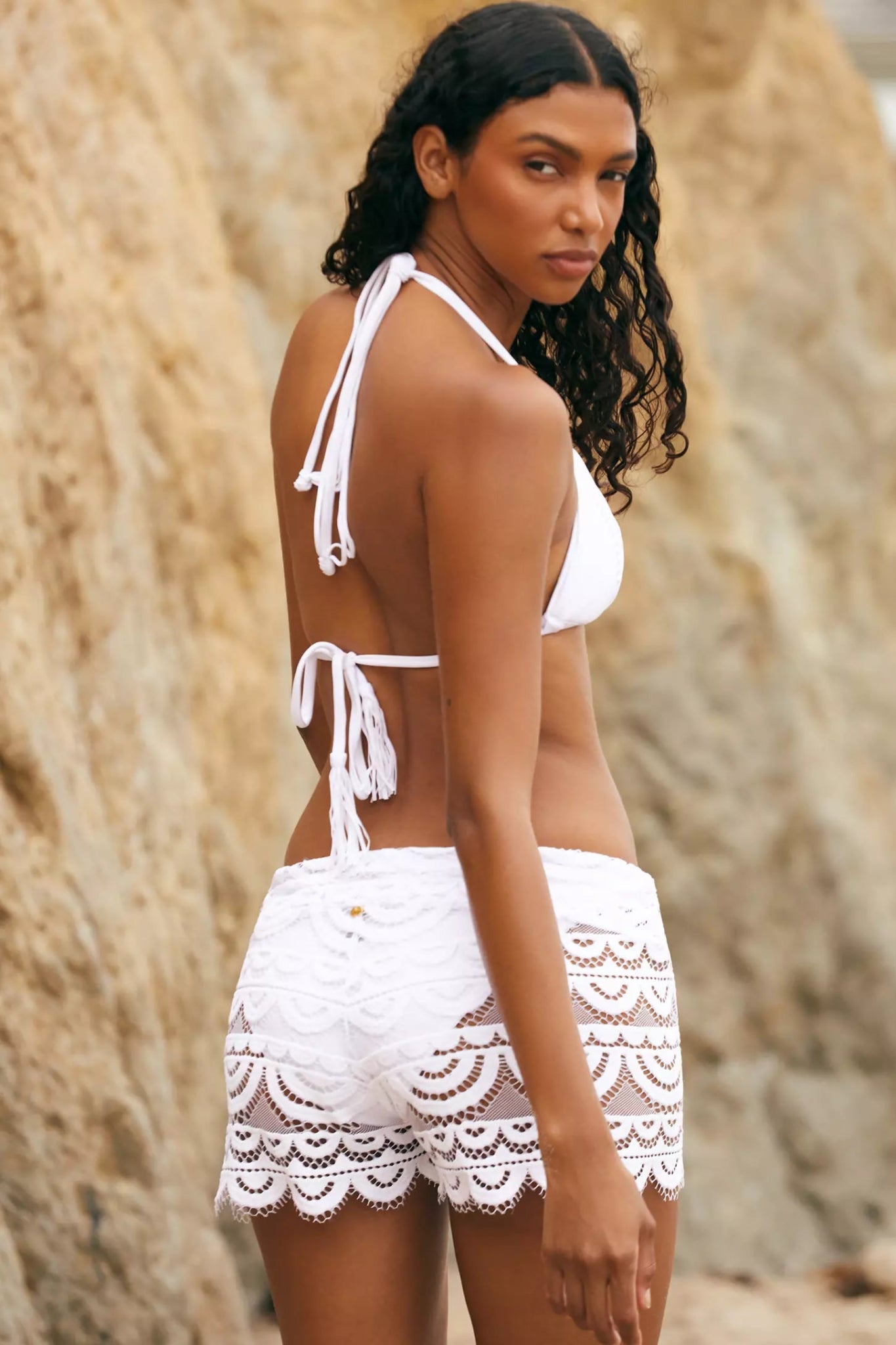 Close-up of PQ Swim Lexi Lace Shorts showing the drawstring waist and scalloped lace detail.