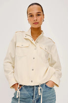 Close up of a woman wearing the Rails Collins Jacket in Ivory, zipped and buttoned up.