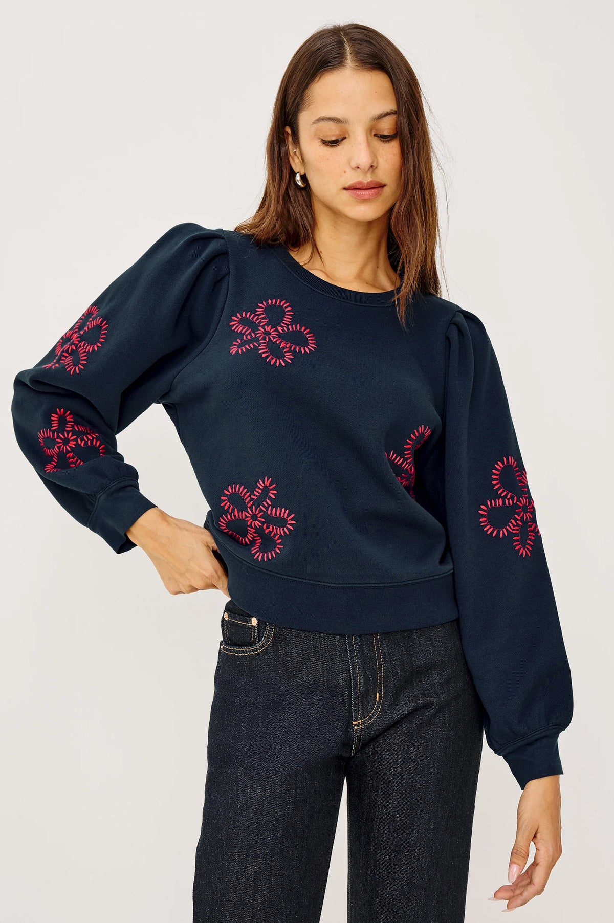 Runway preview: The Rails Tiffany Sweatshirt in Navy with hot pink floral embroidery and puff sleeves, handpicked by Sloane for the Born to Runway event at The Asbury Hotel.