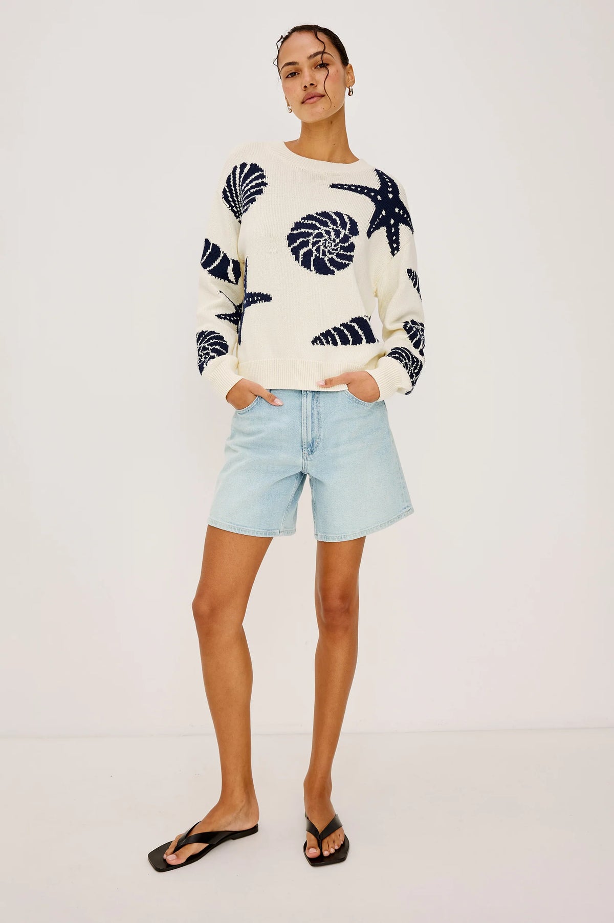 Runway preview: The Rails Zoey Sweater in Seashells, an ecru-toned crewneck featuring navy blue intarsia seashell and starfish patterns, handpicked by Sloane for the Born to Runway event at The Asbury Hotel.
