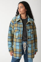Woman wearing the Electric & Rose Scout Jacket in Indigo and Chartreuse plaid Italian wool.